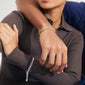 Silver-plated CHARM curb chain bracelet on a woman's wrist, showcasing its statement design ideal for stacking and personalizing with charms.
