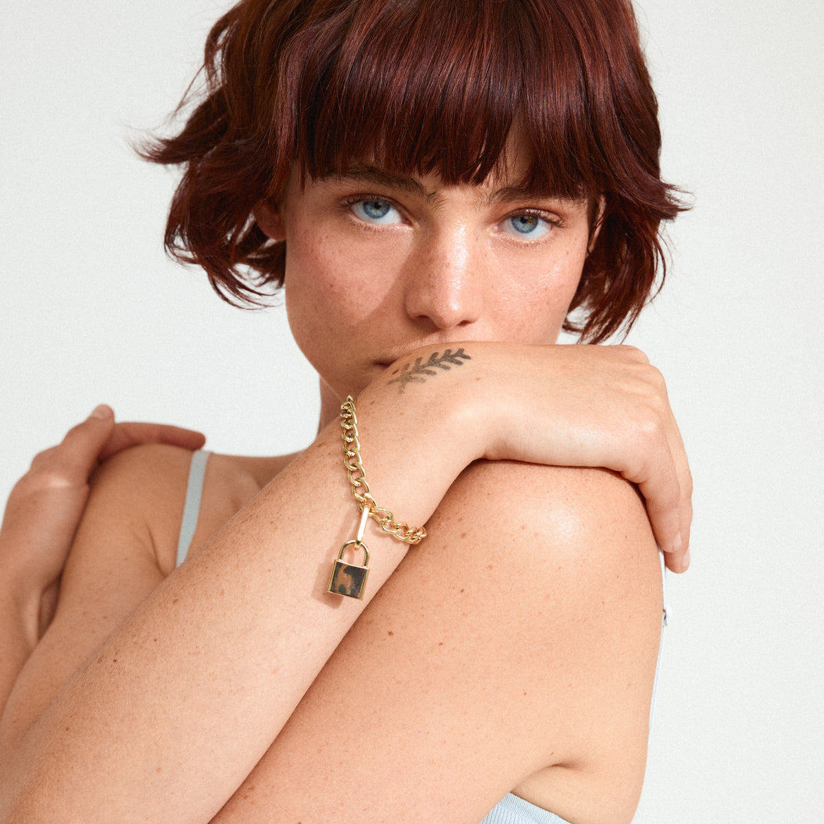 Gold-plated CHARM locket pendant from Pilgrim, featuring a padlock design for a unique, edgy style statement, perfect for personalizing your accessory collection.
