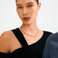 Young woman wearing the CHARM choker gold-plated necklace by Pilgrim; a sleek, minimalist design, perfect for adding charms, reflecting Scandinavian quality and style.