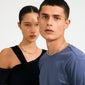 Two young adults model Pilgrim's CHARM choker silver-plated, highlighting its elegant, timeless design with decorative ball clasps for adding charms.