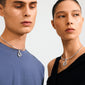 Models showcasing Pilgrim's CHARM curl pendant, silver-plated with a sculptural loop, emphasizing creative flair and sustainable fashion, complementing casual attire.