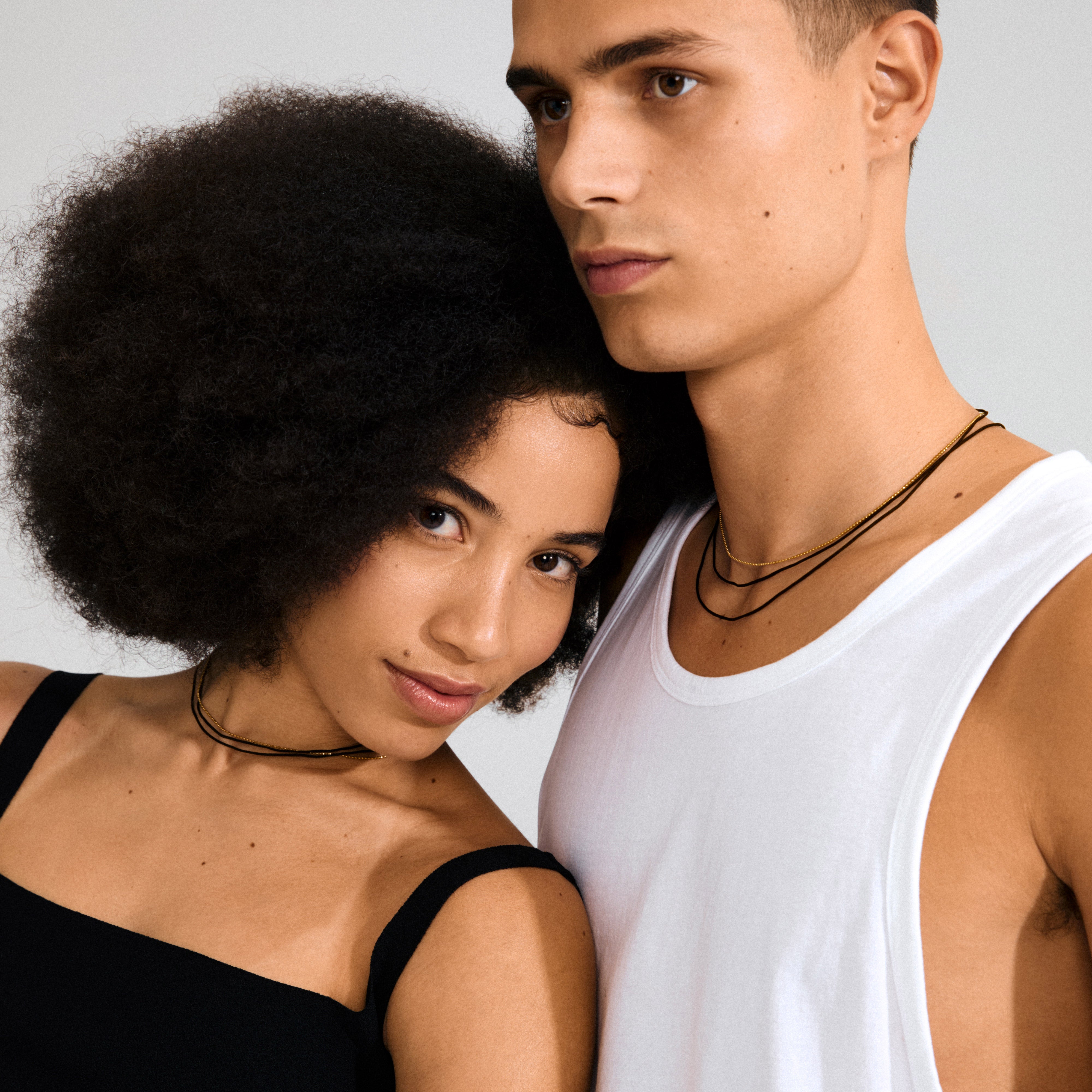 Pilgrim's CHARM necklace 2-in-1 set features a silver-plated chain and a versatile black cotton cord, perfect for creating a personalized, boho-luxe look.