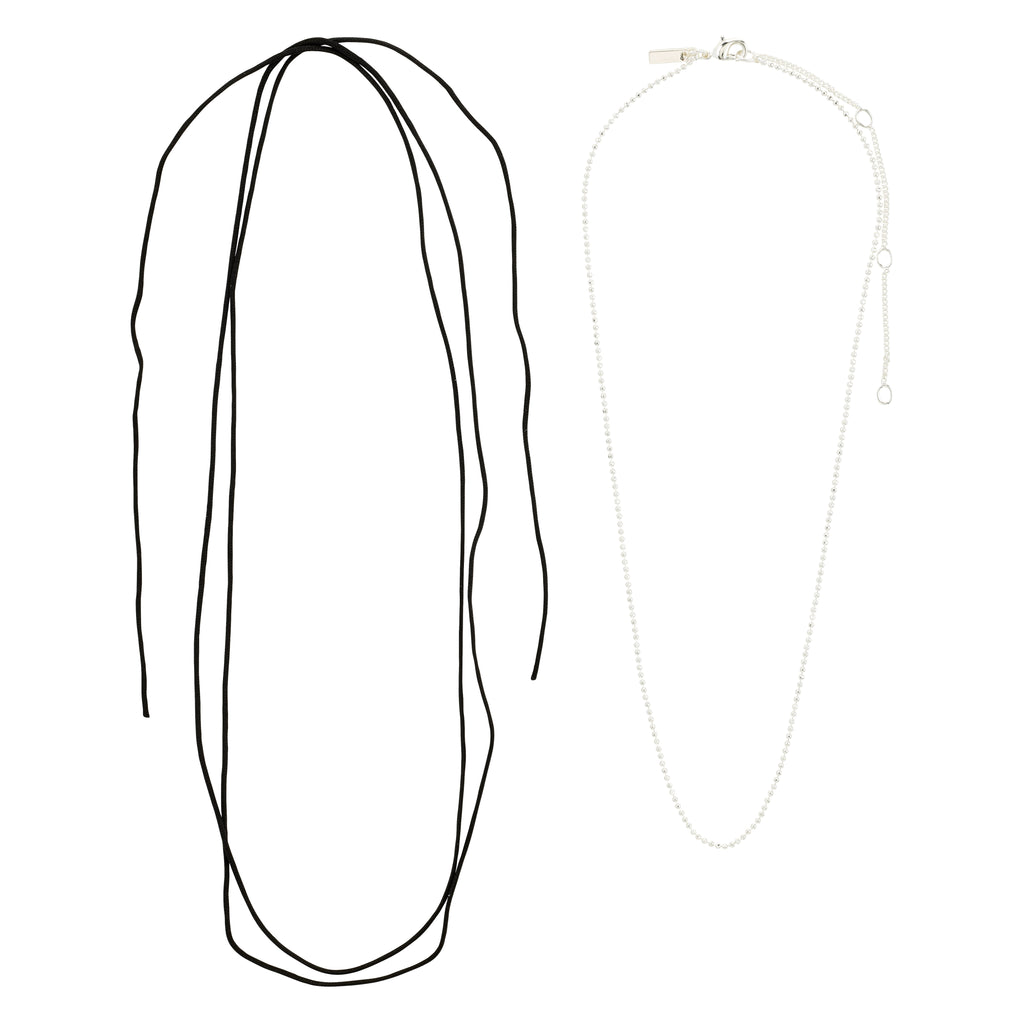Pilgrim's CHARM necklace 2-in-1 set features a silver-plated bead chain and a versatile black cotton cord, perfect for creating personalized, boho-luxe styles.