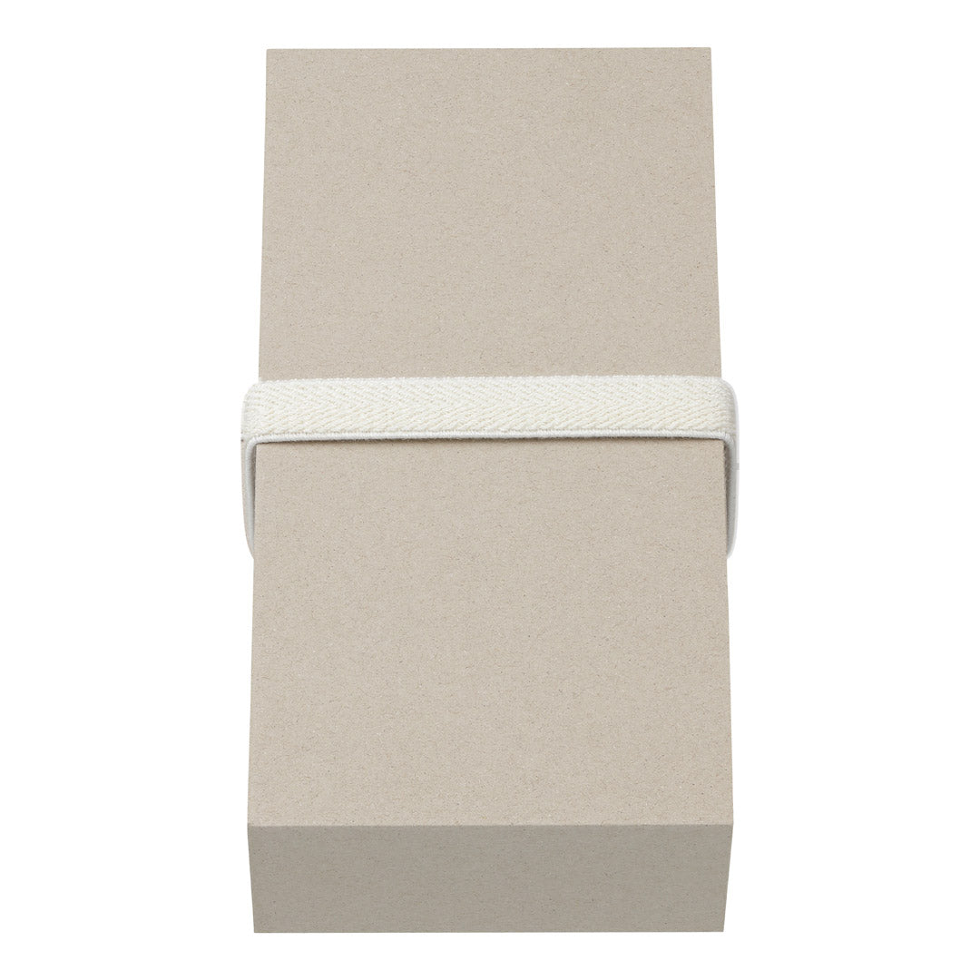 Large gift box with dimensions W85 x H170 x D41 mm, featuring an off-white woven elastic band around its center, from Pilgrim's collection.