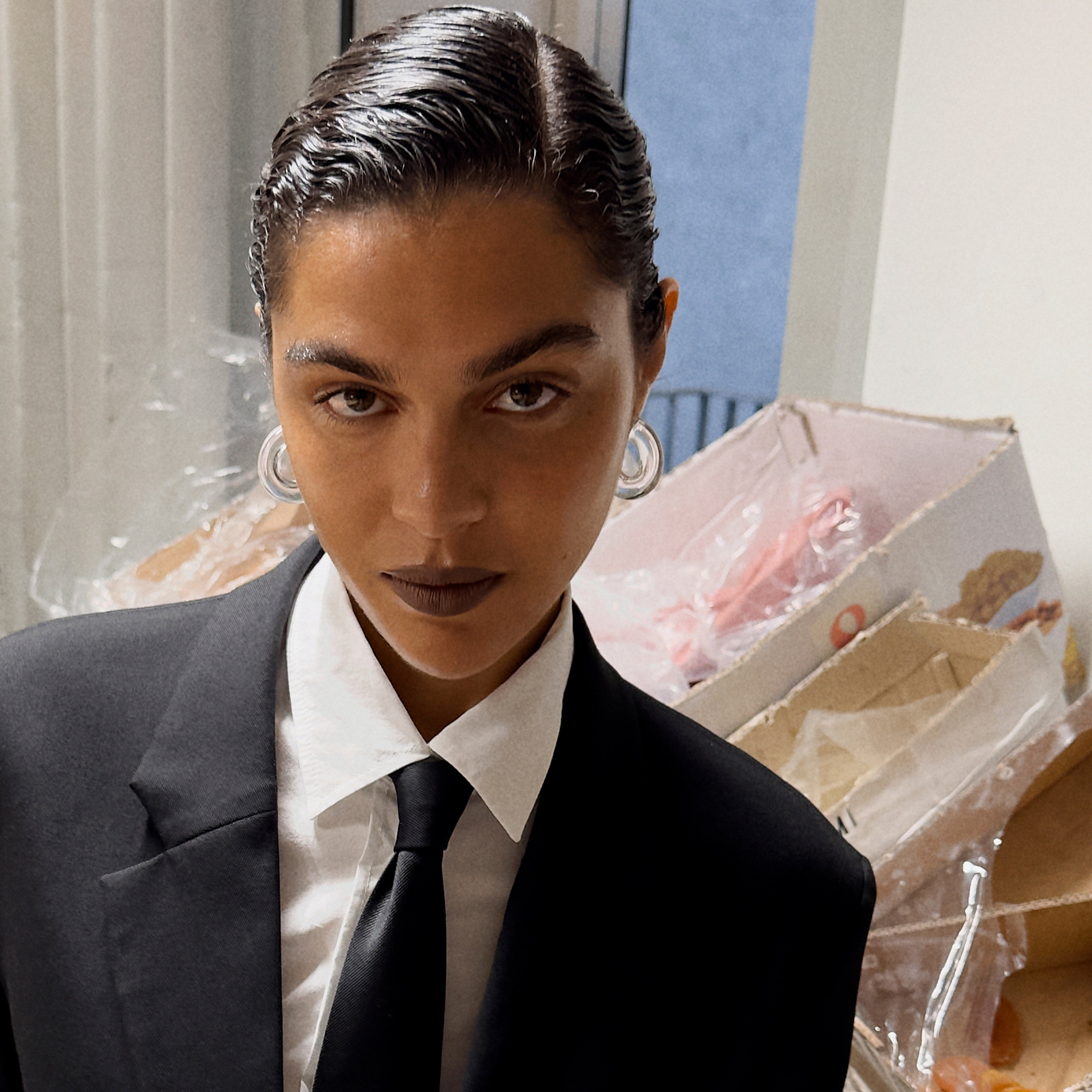 FREJA WEWER x PILGRIM Aqua hoops medium, crystal, worn by person in suit, showcasing chunky, recycled acrylic design. Perfect for stylish, eco-conscious fashion enthusiasts.