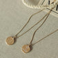 GEMINI Zodiac Sign Coin Necklace, gold-plated, features a double-sided pendant with zodiac motif and crystal constellation, adjustable 40 cm chain with 9 cm extension.
