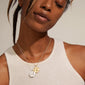 LIBRA Zodiac Sign Coin Necklace, gold-plated, with a double-sided pendant featuring a zodiac motif and crystal constellation, worn by a woman in a white tank top.