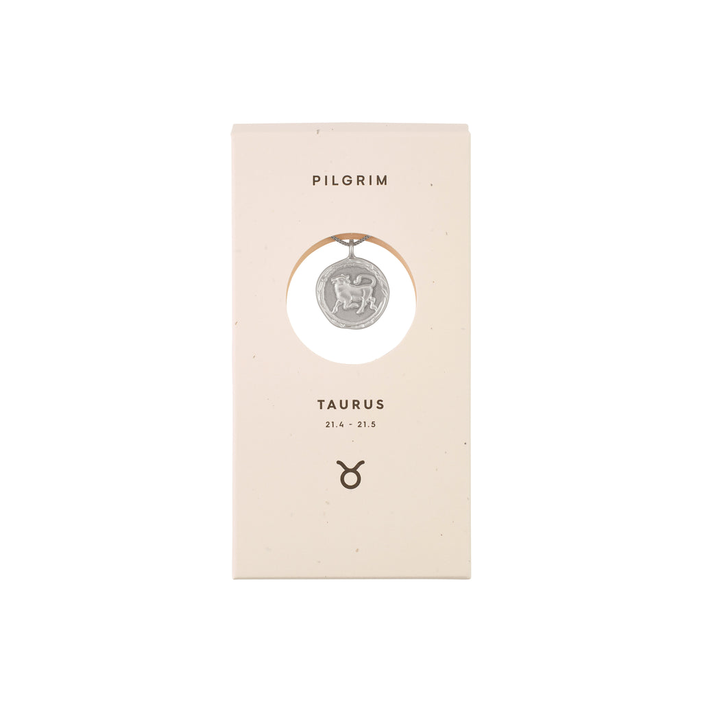 TAURUS Zodiac Sign Coin Necklace, silver-plated, featuring a double-sided pendant with a zodiac motif and crystal constellation, in a white box.