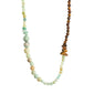 SOULMATES necklace mint/gold-plated features asymmetrical light blue, sand, and dark brown semi-precious beads, ideal for a bold, bohemian style.