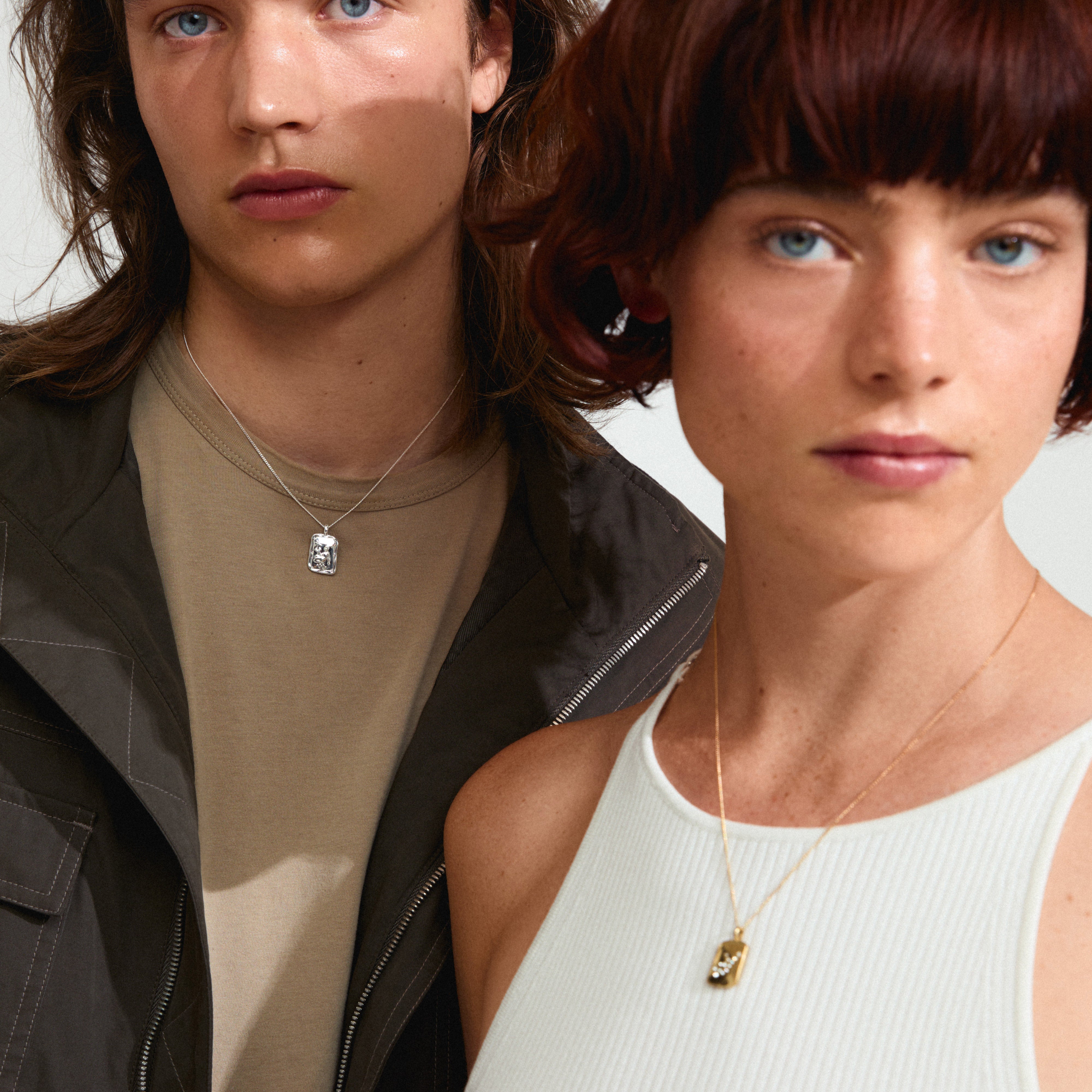 VIRGO Zodiac Sign necklace, silver-plated, with a square coin pendant featuring a Virgo motif and constellation design, worn by a woman.