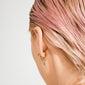 Close-up of a right ear with slicked-back pink-blonde hair, featuring gold-plated Bullet earrings, 5 mm, with a decorative lock bead design, two pieces.