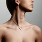 SOPHIA heart pendant necklace, silver-plated, featuring two heart charms on a woman's neck, showcasing a velvet-matt finish and sparkling crystal details.