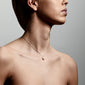 EILA freshwater pearl necklace silver-plated, featuring a droplet-shaped pearl pendant, elegantly worn by a woman, showcasing its modern and timeless design.