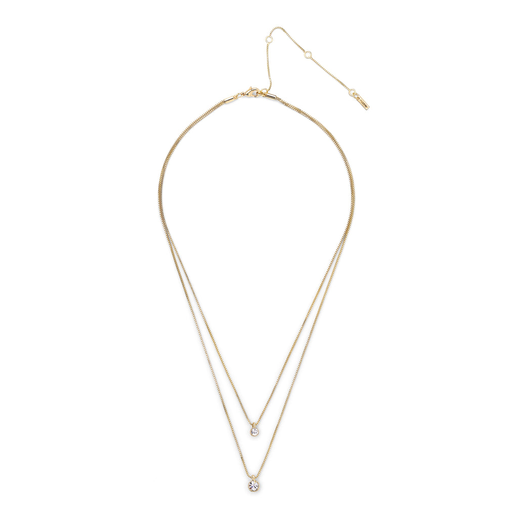 LUCIA 2-in-1 crystal necklace gold-plated, featuring two delicate chains with sparkling crystal pendants, elegantly layered for a chic, eye-catching design.
