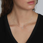 CLARA crystal cross necklace silver-plated, featuring sparkling crystals on a modern cross pendant, worn by a woman, emphasizing its feminine appeal and adjustable chain length.