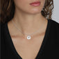 ELIN coin pendant necklace silver-plated on a woman's neck, featuring a delicate tree silhouette, embodying Scandinavian elegance and modern style.