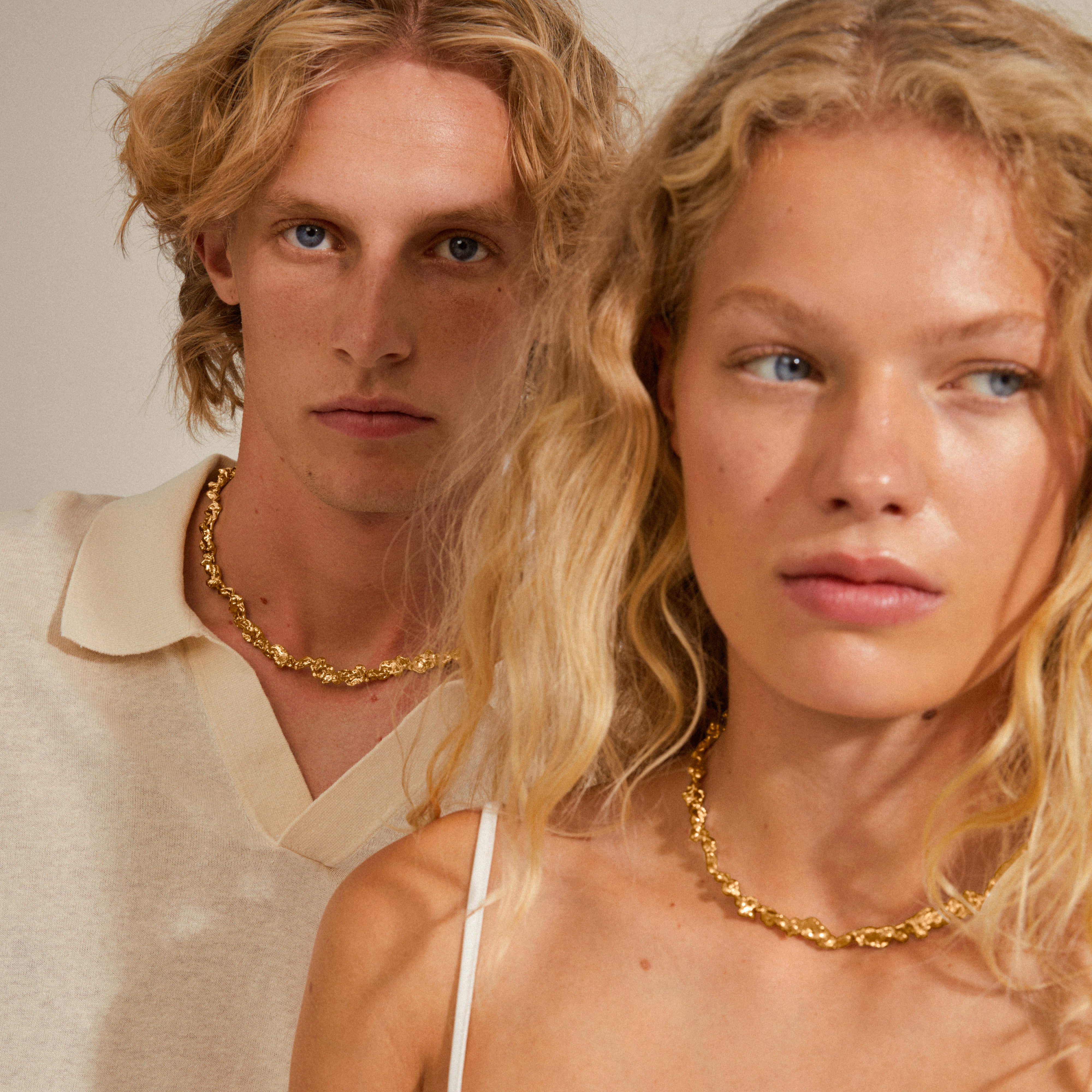 RAELYNN gold-plated necklace with organically formed links, worn by a woman; captures Pilgrim's Scandinavian-inspired, handcrafted elegance.