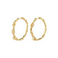 RAELYNN hoops gold-plated earrings with an organic design and small white beads, embodying a handcrafted, playful style ideal for mixing and matching accessories.