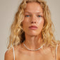 Woman wearing Pilgrim's RAELYNN silver-plated necklace with organically formed links, showcasing its elegant, handcrafted design.