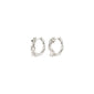 RAELYNN earrings silver-plated feature organic, branch-like hoops with three white pearls, crafted from 97% recycled material, embodying nature's playful elegance.