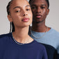 PENELOPE necklace silver-plated showcased on a woman, highlighting its wavy design and graphic silhouette. An elegant, scandi-style accessory from Pilgrim.