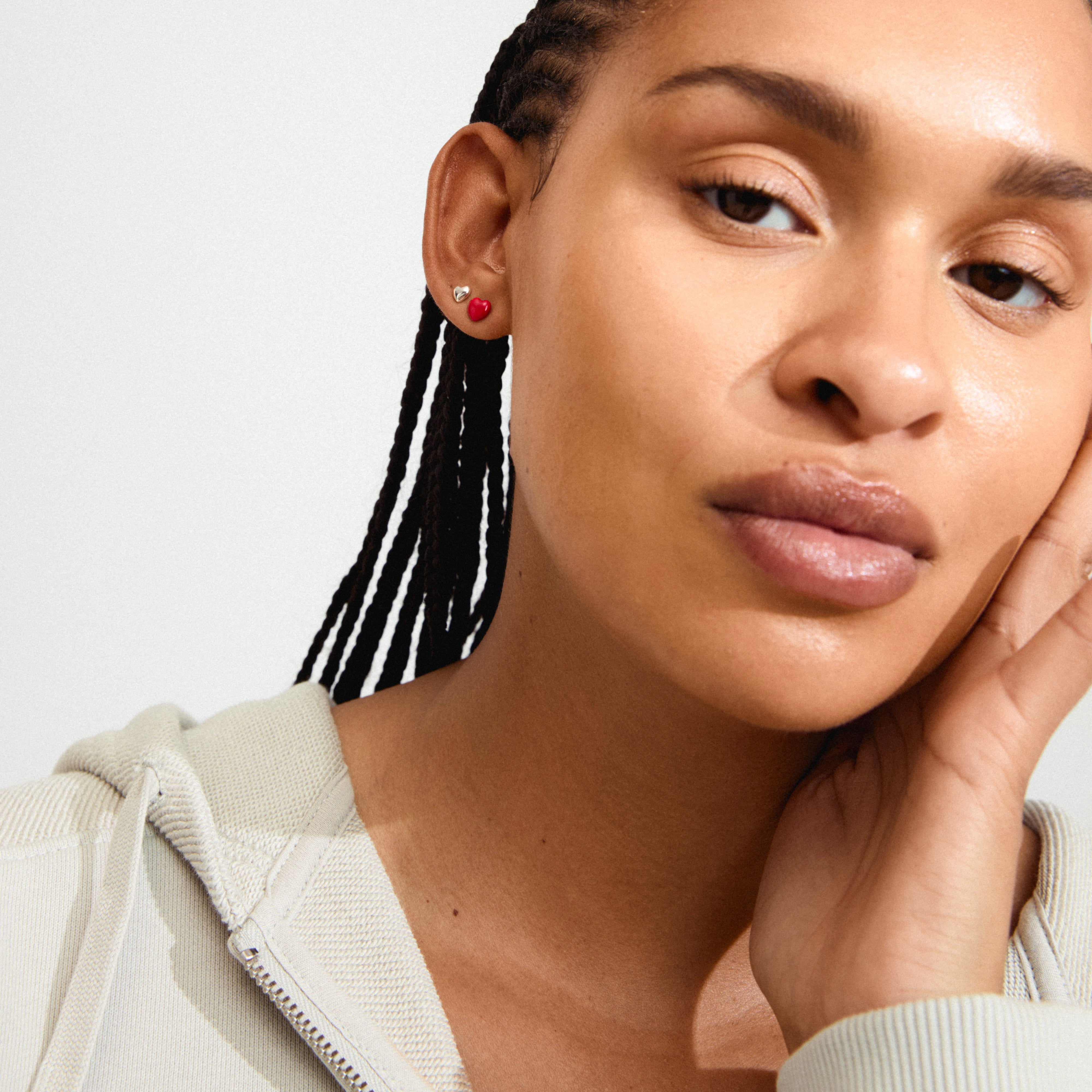 MAEVE earrings 2-in-1 set silver-plated featuring sleek hearts and vibrant red enamel studs, perfect for creating a personalized, stylish ear look.