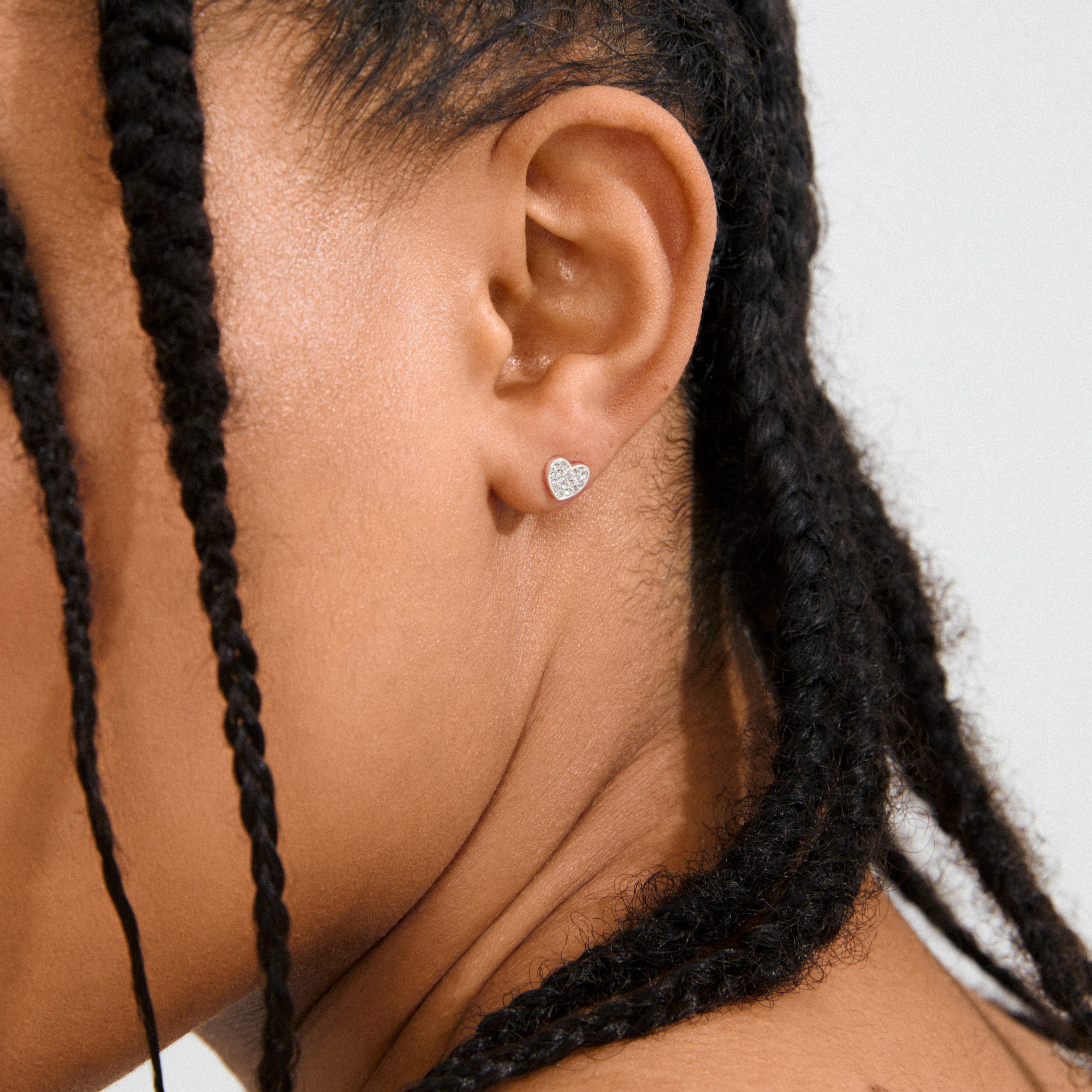 EMMETT earrings silver-plated, heart-shaped studs with Preciosa crystals, perfect for adding elegance and sparkle to any outfit, crafted from 93% recycled materials.