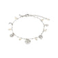 MYLAN bracelet: A silver-plated charm bracelet with pearls, featuring moon, sun, clover, and heart motifs, embodying Pilgrim's mystical and personal style.