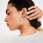 Silver-plated MYLAN earrings with dangling chains and beads on a model's ear, showcasing Pilgrim's luxe boho style with a delicate, layered design.