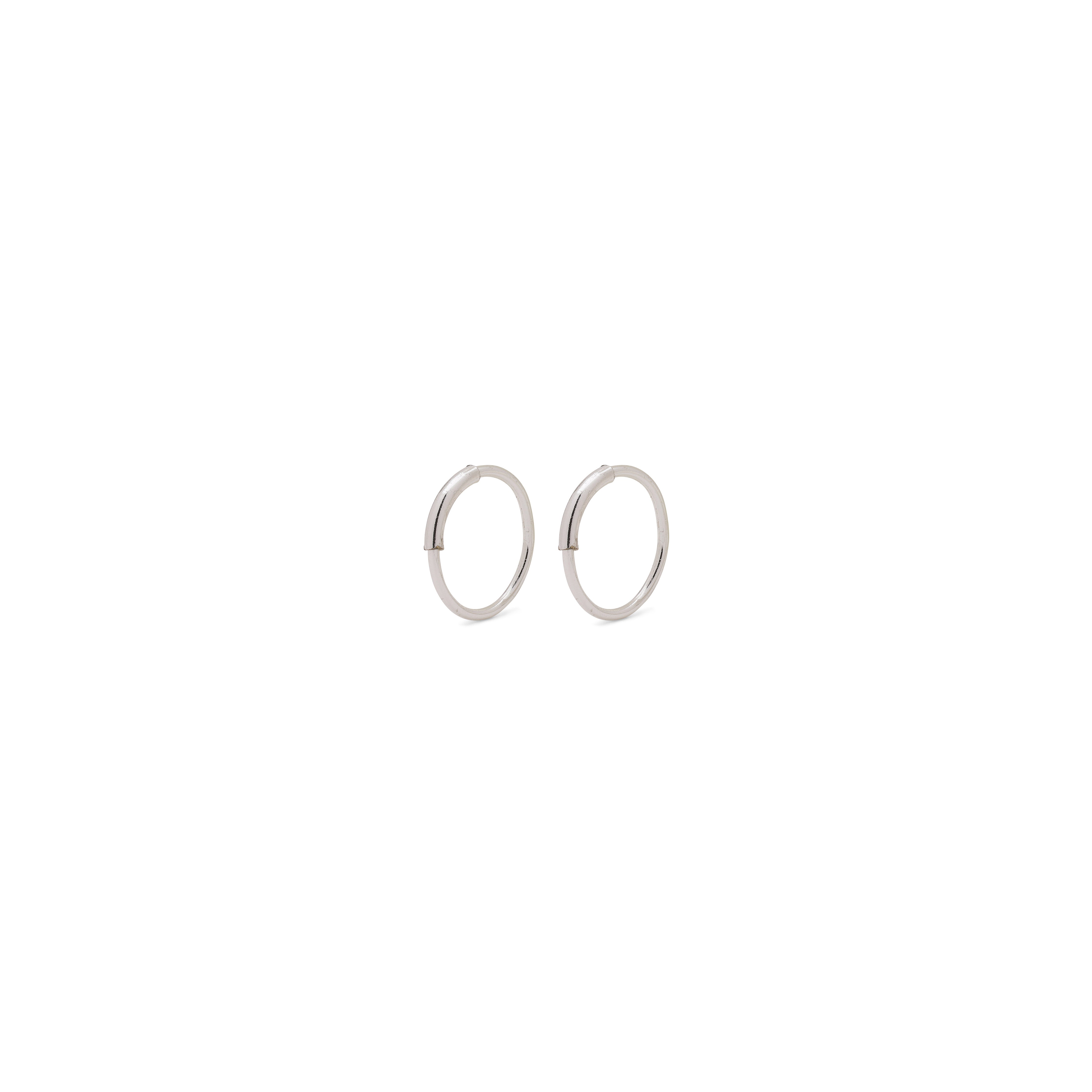 RAQUEL mini hoop earrings, silver-plated, featuring minimalist design with an intriguing outer detail, perfect for versatile styling and appealing to trendsetters seeking timeless Danish craftsmanship.