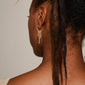 Maja crystal waterfall hoop earrings, gold-plated, featuring an asymmetrical pendant with Preciosa crystals and round ball-chains for a stylish, lively expression.
