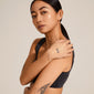 MAJA crystal multi drops bracelet in silver-plated design, featuring sparkling crystals on a delicate chain, worn by a woman with a tattooed hand.