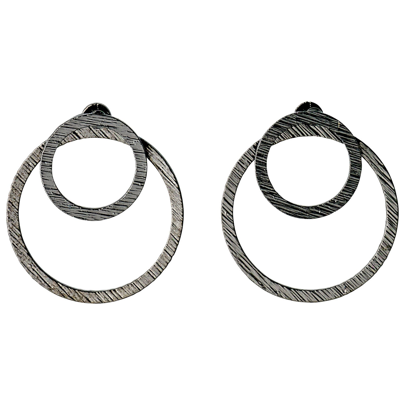 ZOOEY 2-in-1 earrings featuring stylish silver hoops with a rustic embossed pattern, designed for a distinctive 3D effect behind the earlobe.