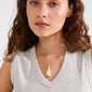 Close-up of a woman wearing the ALMA gold-plated necklace, featuring a teardrop pendant on a fine chain, embodying Nordic-inspired minimalism and crafted from recycled materials.