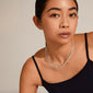 LILY chain necklace silver-plated showcased on a woman, featuring a trendy layered look with eight different chain styles, highlighting its fashionable and versatile design.