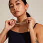 Woman holding the LILY chain necklace, silver-plated, featuring a trendy mix of eight different chains for a stylish, layered look.