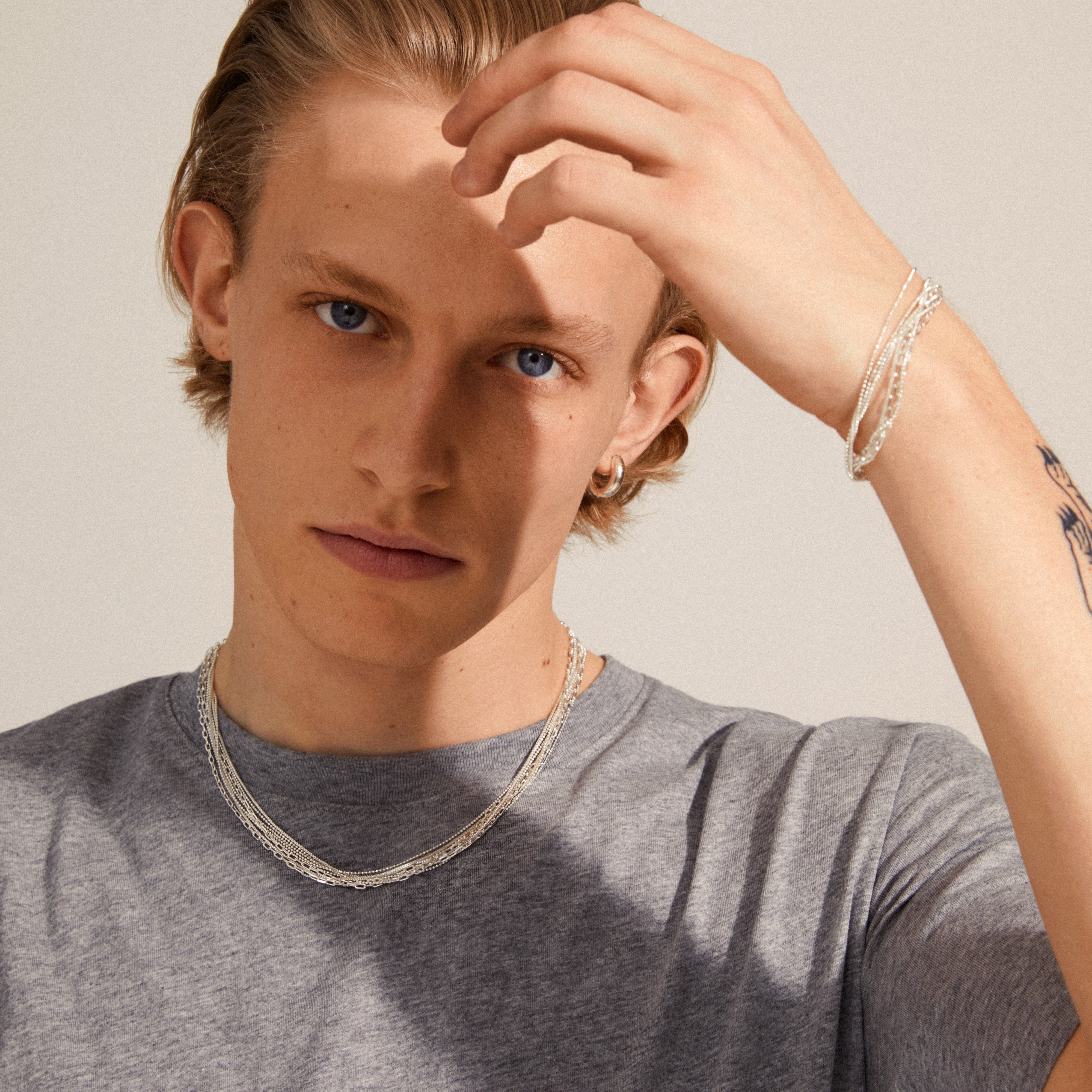 LILY chain bracelet silver-plated showcased on a person's wrist, highlighting its layered design and intricate chain details.