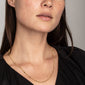 Gold-plated CAT necklace with a textured, flattened-link design, worn by a woman, showcasing its 50 cm length with a 9 cm extension.