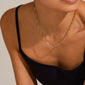 Close-up of a person wearing the RONJA necklace gold-plated, featuring simple, sharp rectangular links, perfect for a classic yet bold style statement.