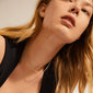 Woman wears gold-plated PAM robe chain necklace, showcasing its elegant, chunky twisted cord design, embodying Pilgrim's blend of timeless and trendy jewelry.