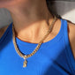 FUCHSIA curb chain necklace, gold-plated, worn by a person, showcasing its chunky, bold design from Pilgrim's Classic collection.