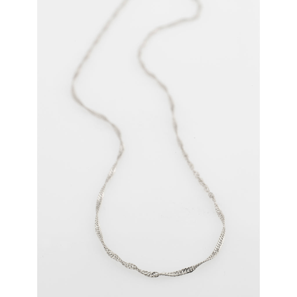 PERI twirl necklace, silver-plated, featuring a minimalist design with a pendant on a delicate chain, perfect for adding a feminine touch to any outfit.