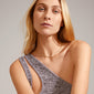 JOANNA flat snake chain necklace gold-plated showcased on a woman, highlighting its elegant design and timeless appeal, perfect for enhancing any outfit with sophistication.