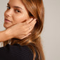 LULU crystal heart stack ring silver-plated, adorned with Preciosa crystals, displayed on a woman's hand touching her face, emphasizing elegance and simplicity.