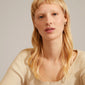 COBY crystal square hoop earrings, gold-plated, worn by a blonde woman showcasing the sparkling Preciosa crystals and classic design.