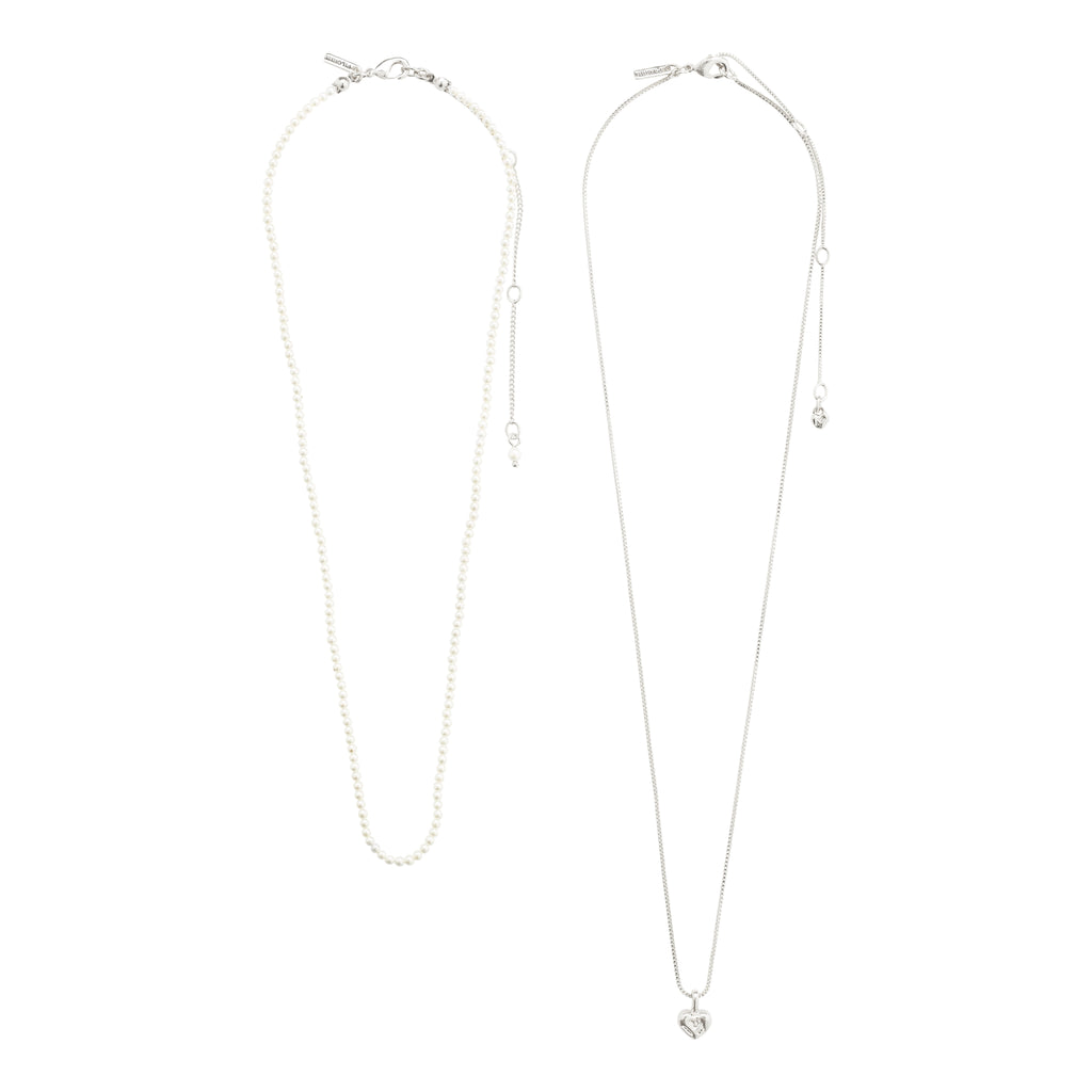 ARLET necklace 2-in-1 set, featuring a silver-plated chain with heart pendant and a pearl necklace, showcased on a white background.