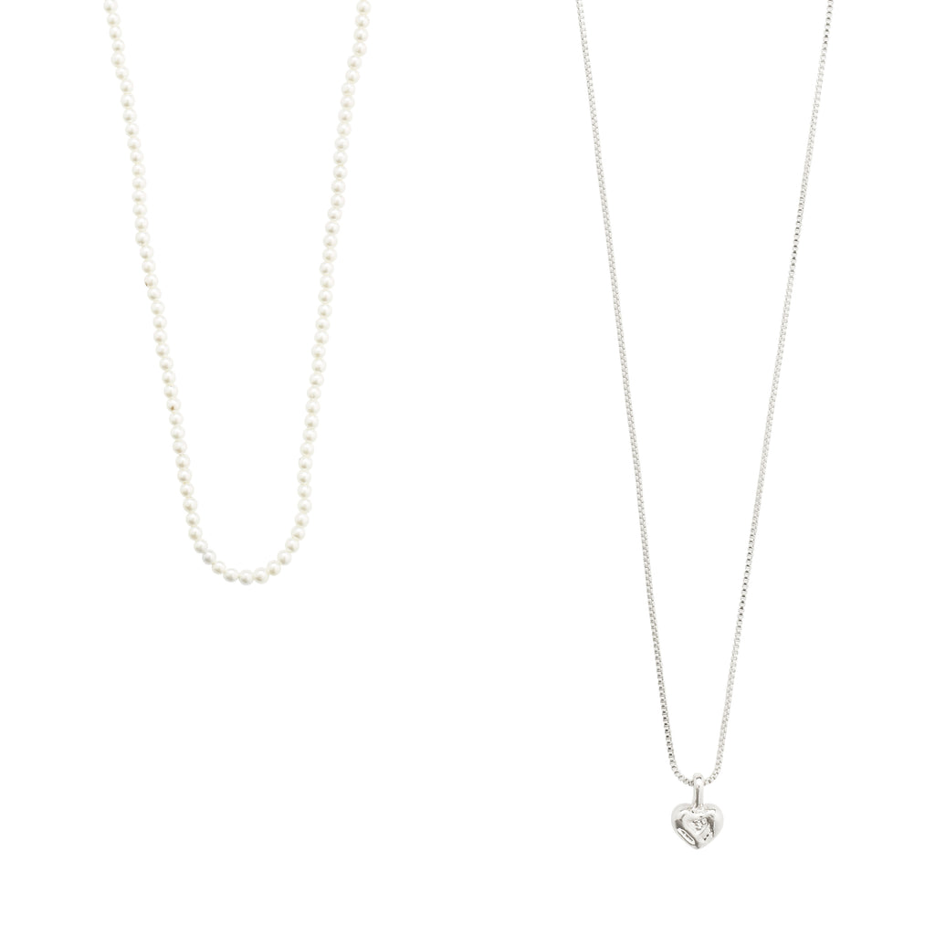 ARLET necklace 2-in-1 set featuring a silver-plated heart pendant and a pearl necklace, perfect for layering fashionable looks.