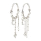 ARLET silver-plated hoop earrings adorned with freshwater pearls, Preciosa crystals, moon pendants, and heart charms, offering a romantic boho-lux style.