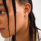 DECLAN gold-plated hoops by Pilgrim, featuring twisted details and click clasps, crafted from 99% recycled materials for a timeless yet trendy look.