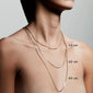 Close-up of a woman's neck wearing the NANCY necklace, 50 cm gold-plated chain, showcasing its versatility and elegant design.